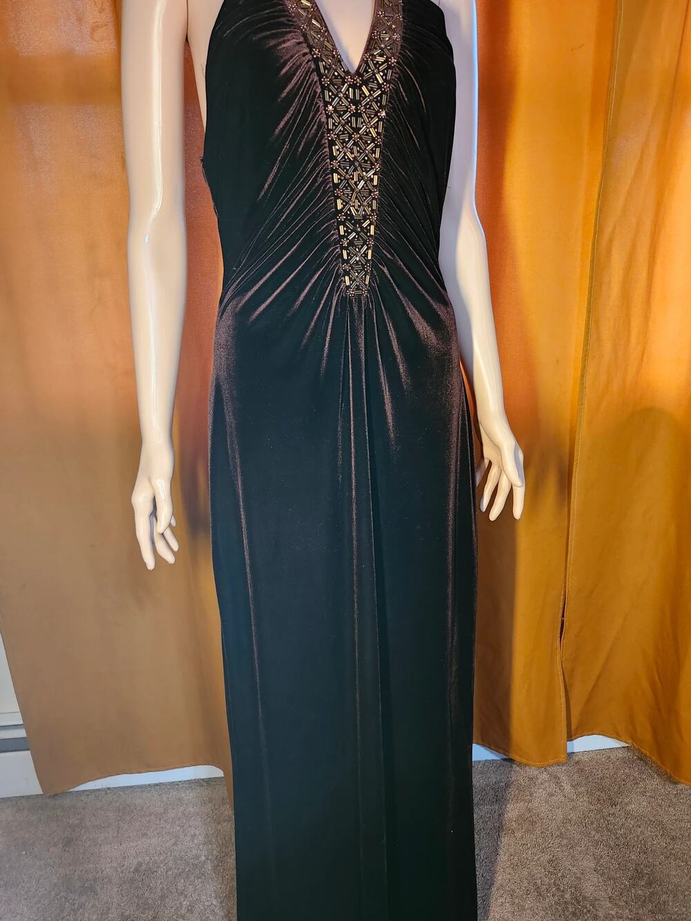 Black halter maxi dress with beaded neckline and ruched bodice